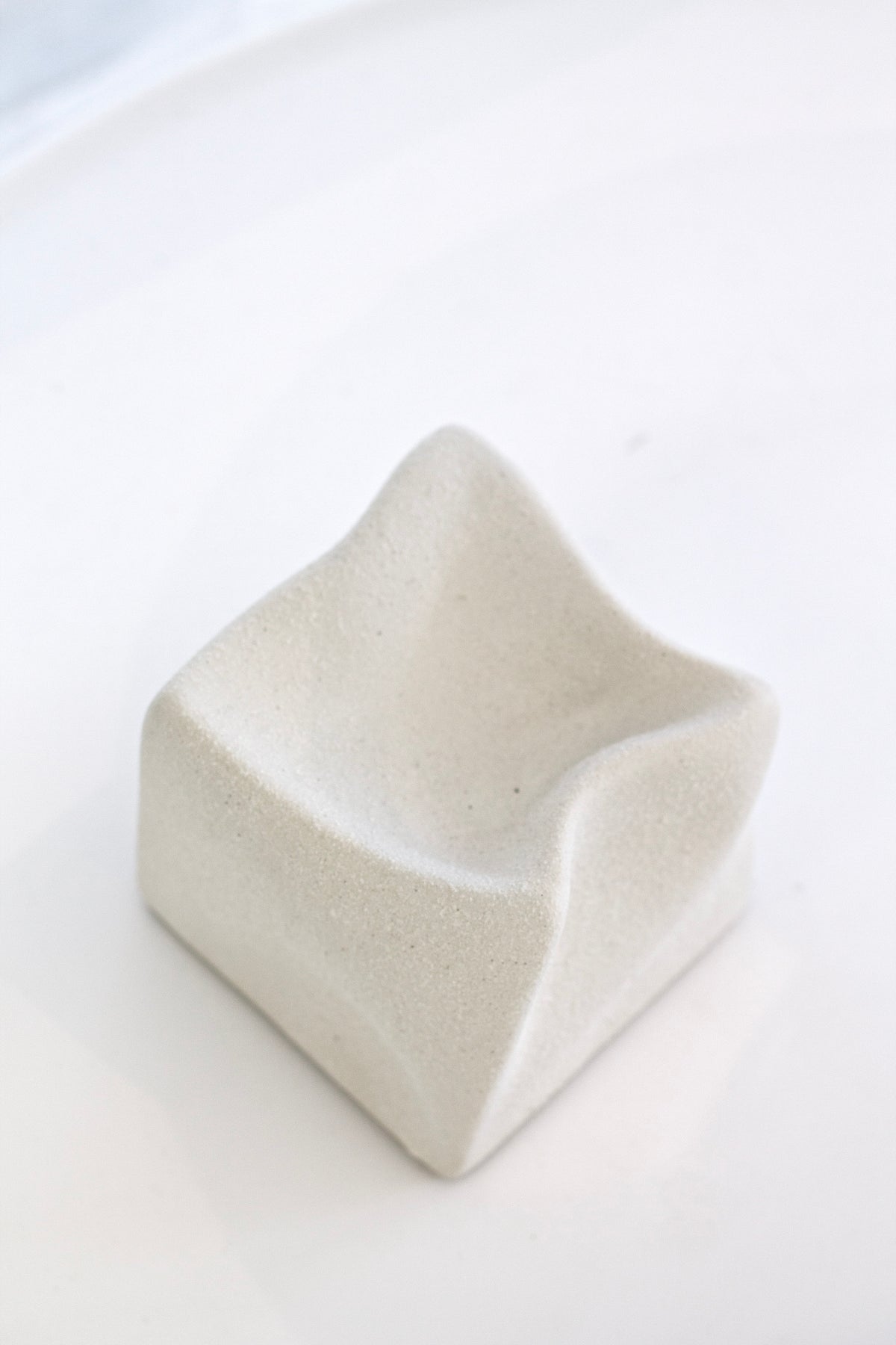 White Cubic Crush cube from above, showing the dished top and folded corners
