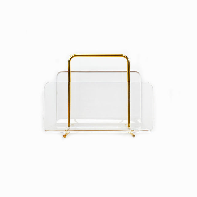 Clear acrylic document holder with gold frame on a desk