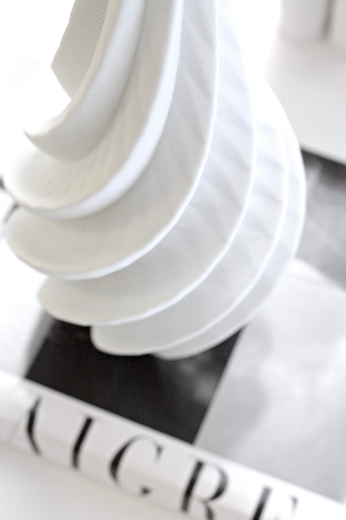 Close view of the spiral vase, the ribboned curves winding down towards the base