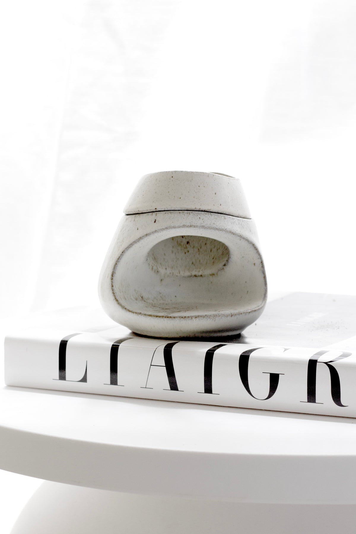 Fort Ceramic Wax Burner styled on a bedside table