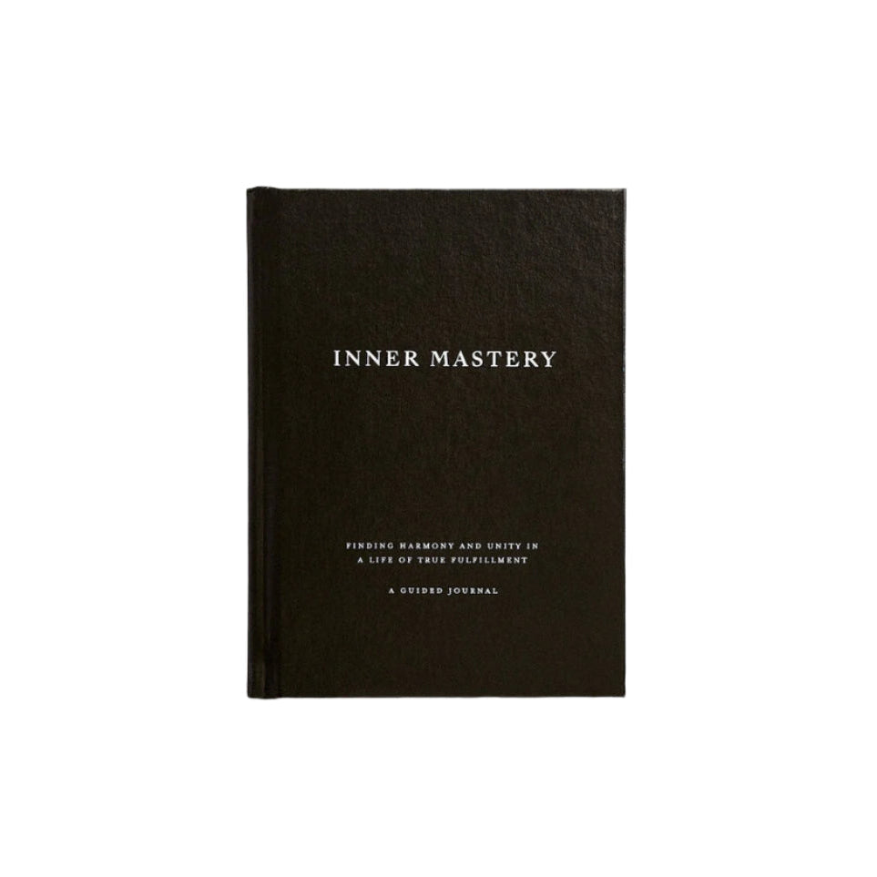 Inner Mastery journal with a black cover and white title, on white
