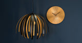 Detail of the pleated gold steel on the Sensu wall clock