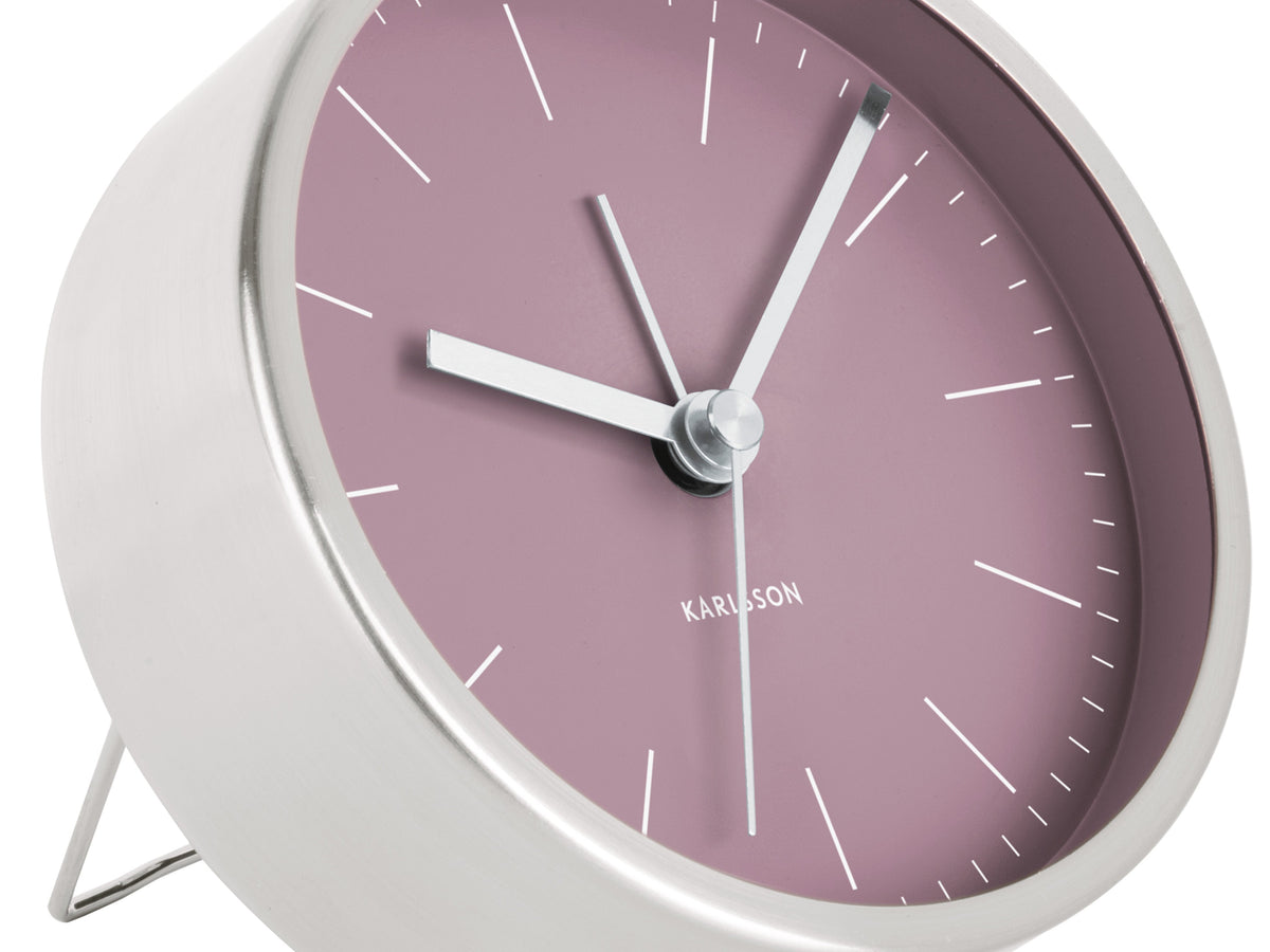Close view of the purple Minimal Alarm Clock face with nickel hands and stand