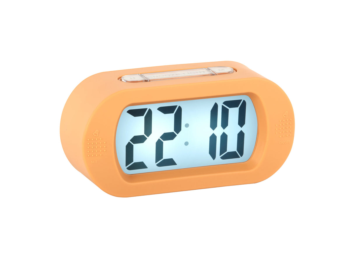 Karlsson Gummy Digital Alarm Clock in soft orange, angled view with the backlit display lit