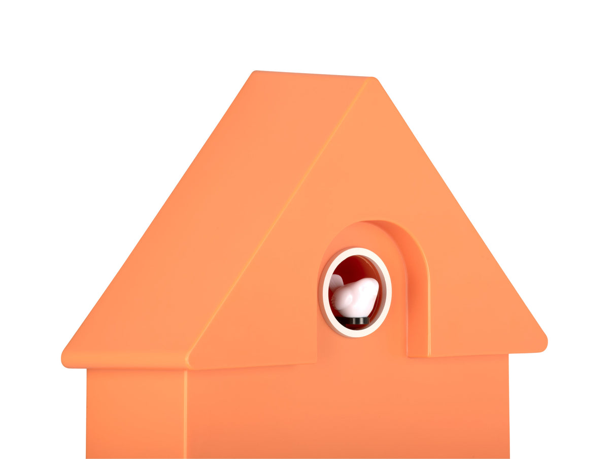 Karlsson Modern Cuckoo Clock in Bright Orange, angled close-up of the case and cuckoo window