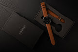 Karlsson Normann mens watch in black with tan leather strap and silver casing
