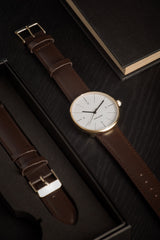 Karlsson Normann mens watch in white with chocolate leather strap and gold casing