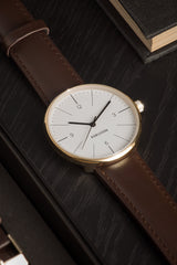 Karlsson Normann mens watch in white with chocolate leather strap and gold casing