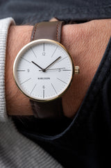 Karlsson Normann mens watch in white with chocolate leather strap and gold casing