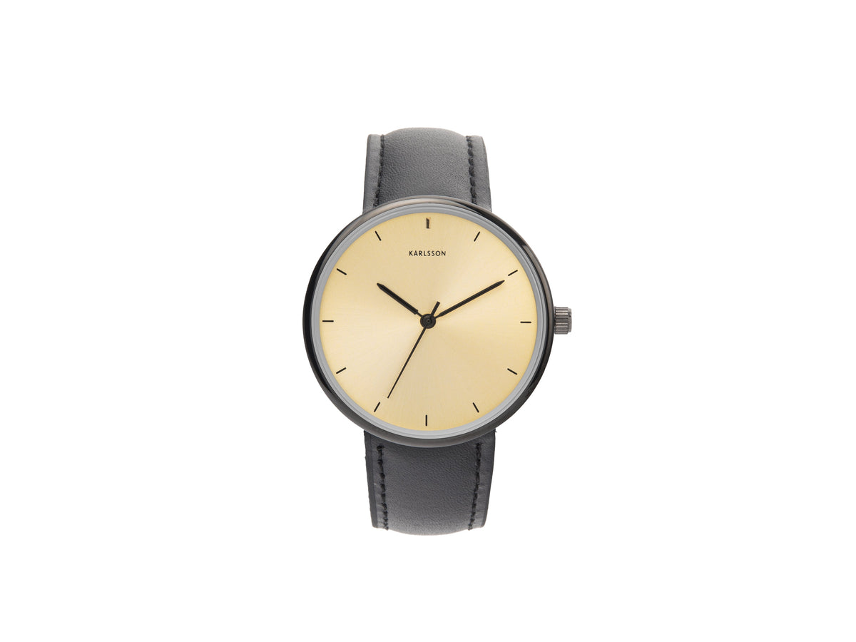 Karlsson Finesse watch with a gold dial and black leather strap, front view