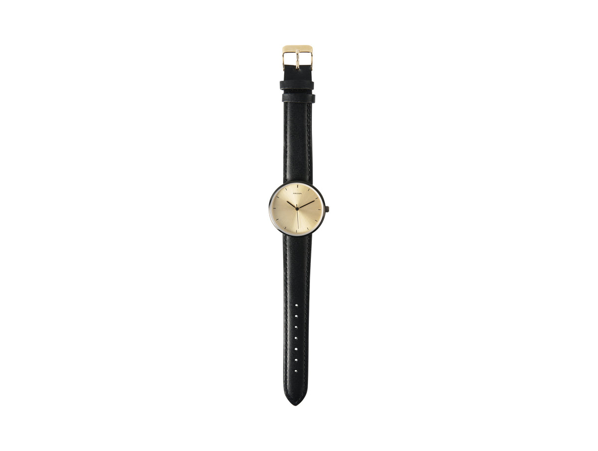Karlsson Finesse watch photographed flat with the black leather strap extended