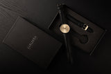 Karlsson Finesse women's watch with black case and gold dial on black leather strap