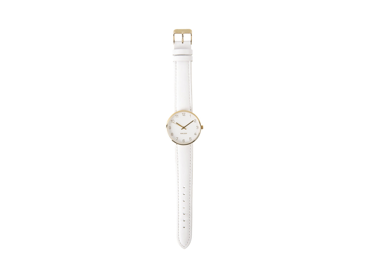 Karlsson Charm watch photographed flat with the white leather strap extended
