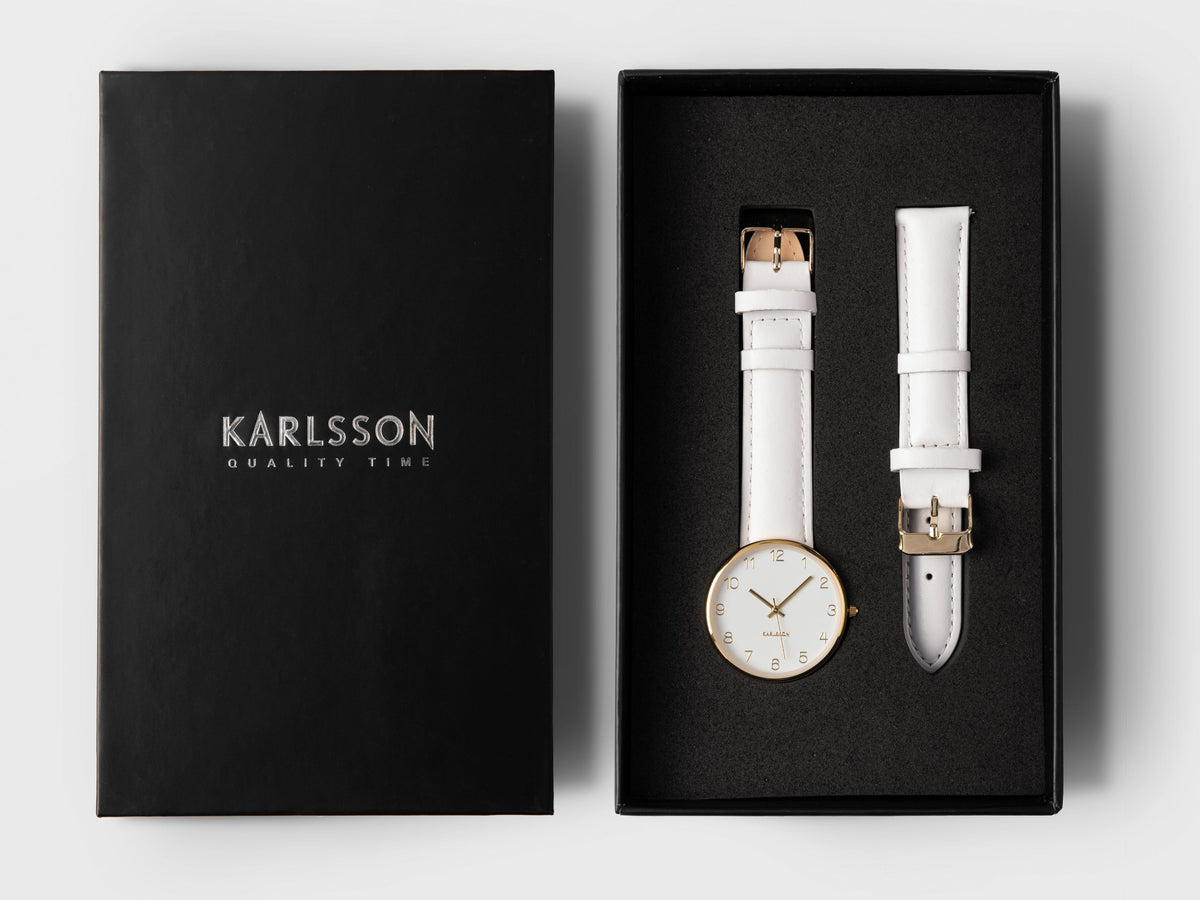 Karlsson Charm watch in its black Karlsson presentation box with a spare white leather strap