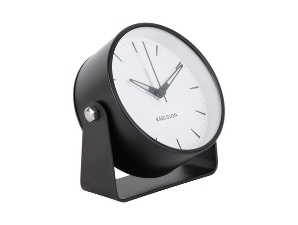 Karlsson Calm Alarm Clock in black, angled on its stand against a white background