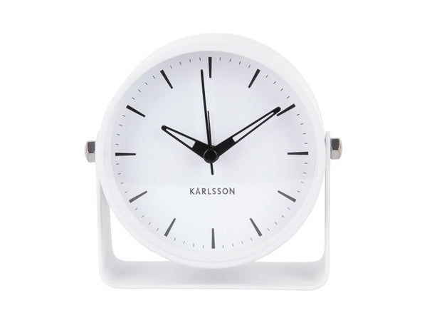 Front view of the white Karlsson Calm alarm clock showing its clean dial and curved stand