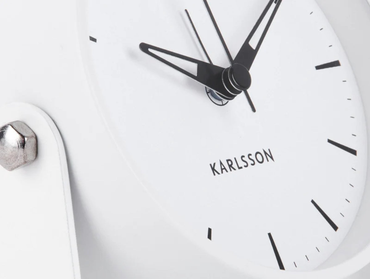 Close-up of the white Calm alarm clock dial with Karlsson logo and slim black hands