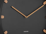 Close up of the black Grace clock dial and wood accented markers
