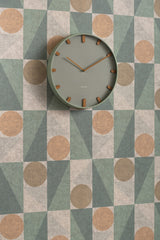 Grayed jade Grace wall clock shown in a styled interior