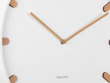 Close up of the white Grace clock dial and wood accented markers