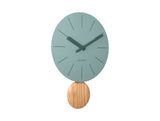 Jungle green Arlo pendulum clock shown from an angle