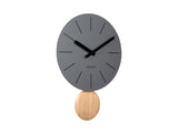 Dark grey Arlo pendulum clock shown from an angle