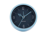 Night blue Monocle alarm clock shown from an angle