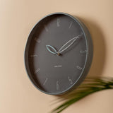 Dark grey Petals wall clock styled on a wall