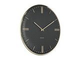 Detail of the black Riqueza clock dial with gold markers