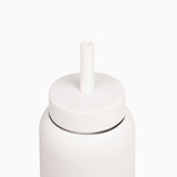 A Day Bottle with Hydration Tracker - Various Options by Bink with a white lid on a white surface.