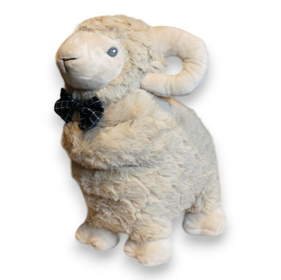 Liam the Ram plush toy in cream with curled horns and a navy check bow tie, on white