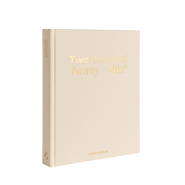 Beige planner with 'Two thousand Twenty Six' text on a white background