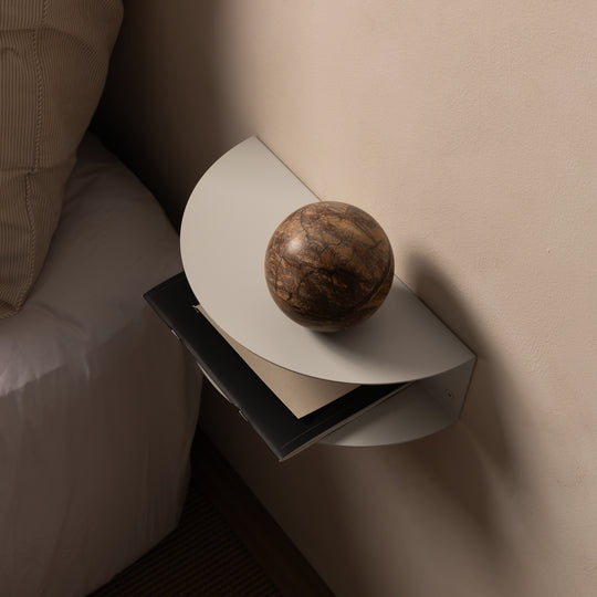 FOLD Bedside Table Mini from above, holding a stone ball with books below