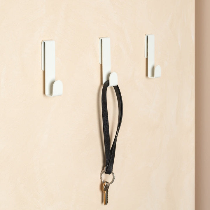 Fold Loop Hook White mounted in an entryway by Made of Tomorrow