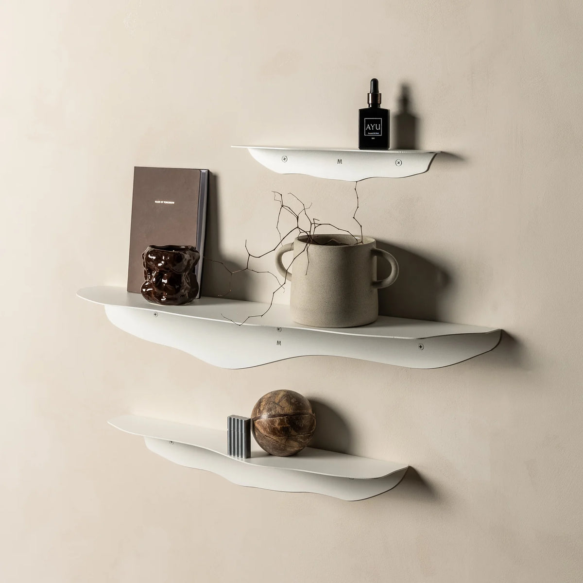 FOLD Wavy Shelf in black mounted on a wall by Made of Tomorrow