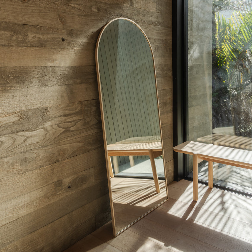 Framed Arch Mirror full length styled against a wall by Made of Tomorrow