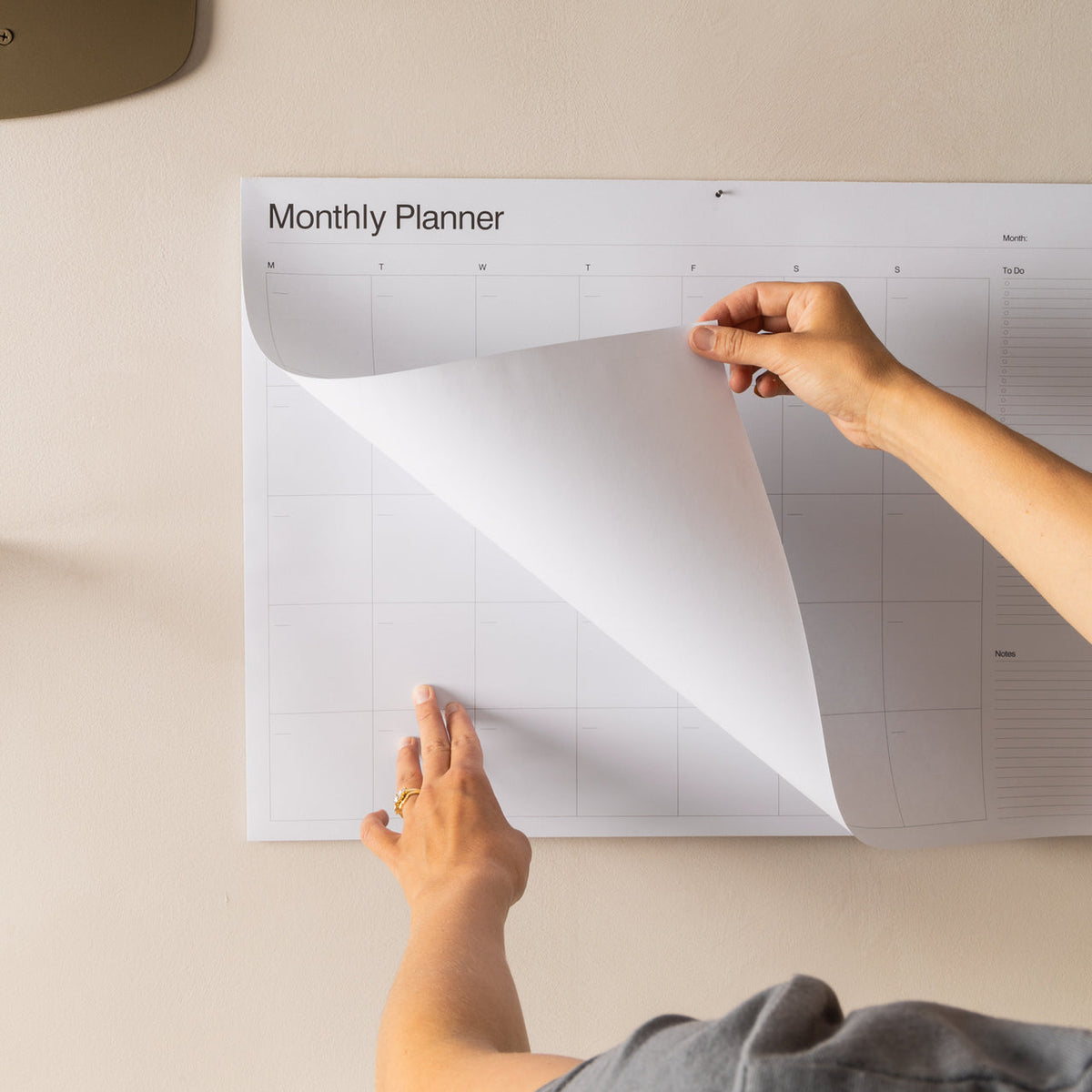 A2 Monthly Wall Planner with notes and to-do sections filled in