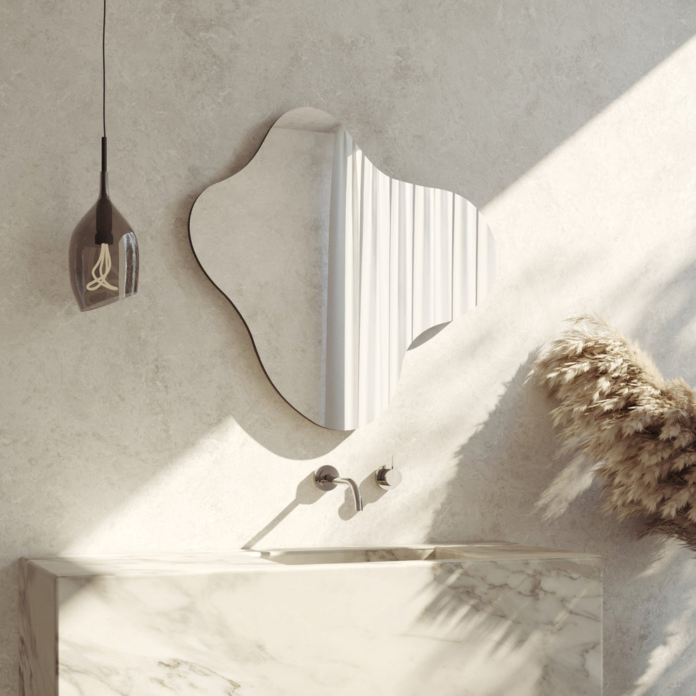 Blob wall mirror by Made of Tomorrow mounted on a wall