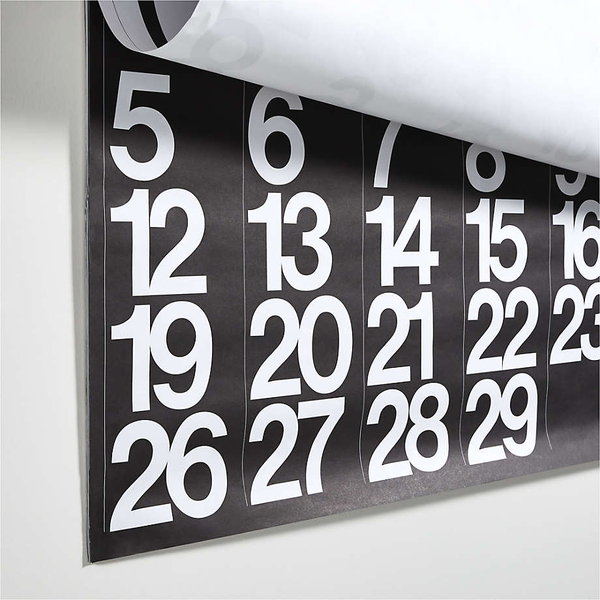 A 2024 Stendig Calendar - PREORDER hanging on a wall.
