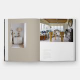 An LANGUAGE OF HOME: THE INTERIORS OF FOLEY & COX book with a picture of a living room.