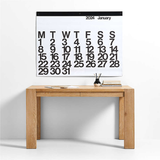 A modern graphic desk with a 2024 Stendig Calendar - PREORDER on top.