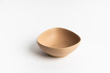 A beige Ned Collections KOS Bowl on a white surface.