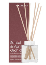 Scented room diffuser with sticks and packaging labeled 'Naturals' on a white background