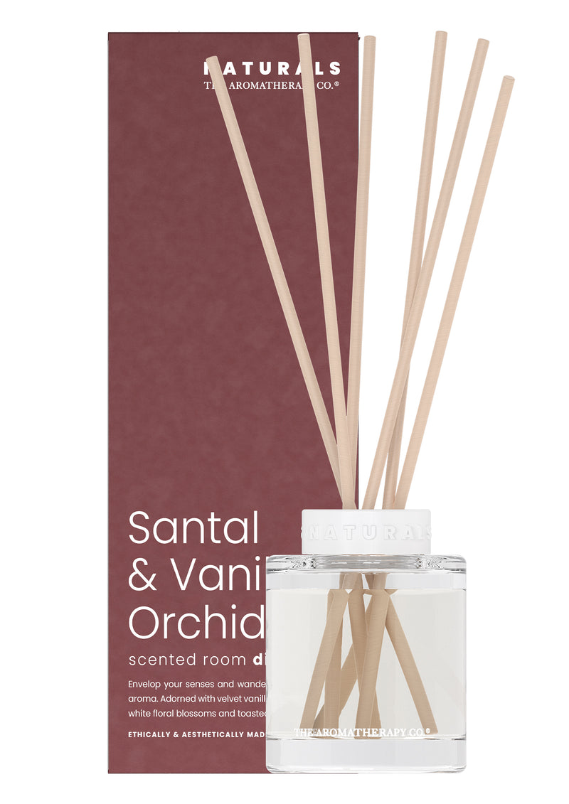 Scented room diffuser with sticks and packaging labeled 'Naturals' on a white background
