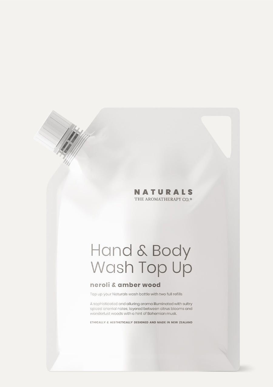 Naturals Neroli & Amber Wood Hand & Body Wash Top Up refill pouch on a pale background