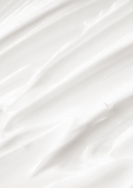 Close up of white lotion spread in streaks