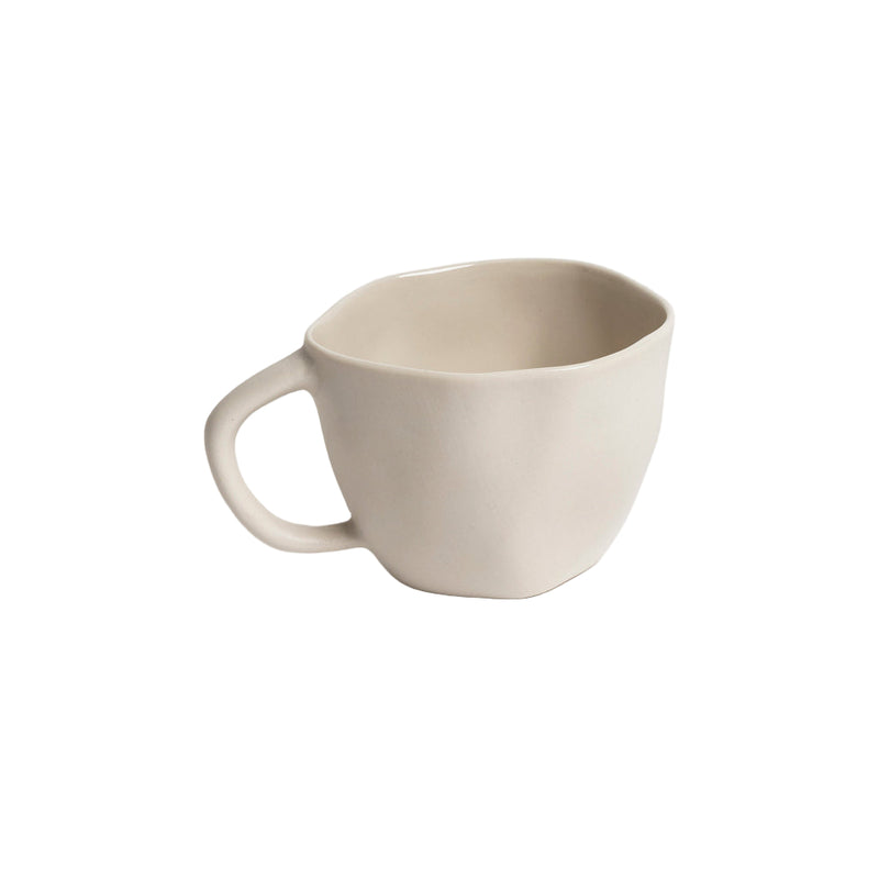 Beige ceramic mug on a white background