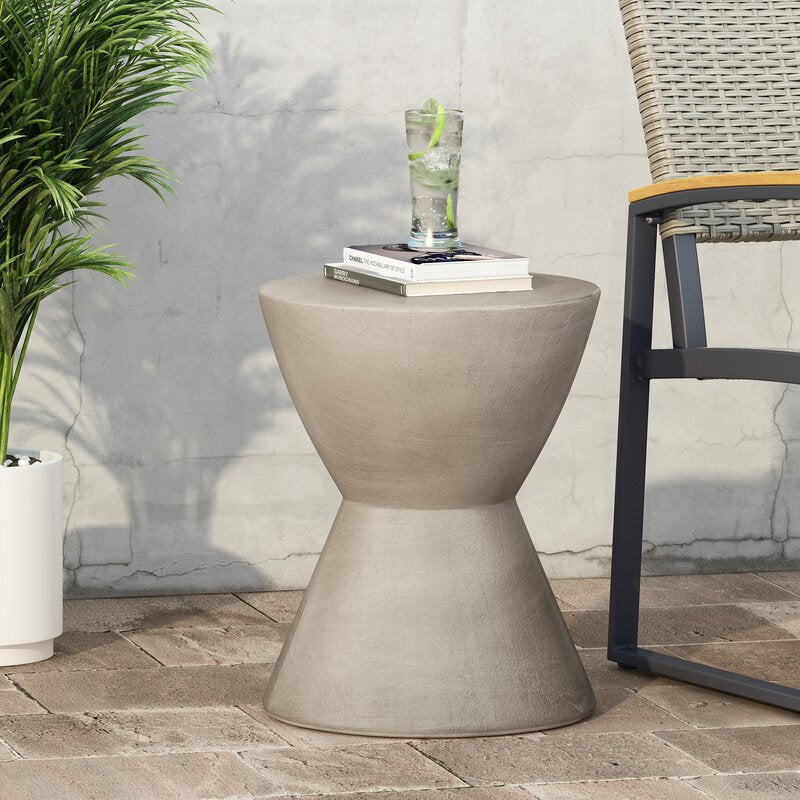 Stonewash accent table on white, the narrow waist between top and flared base