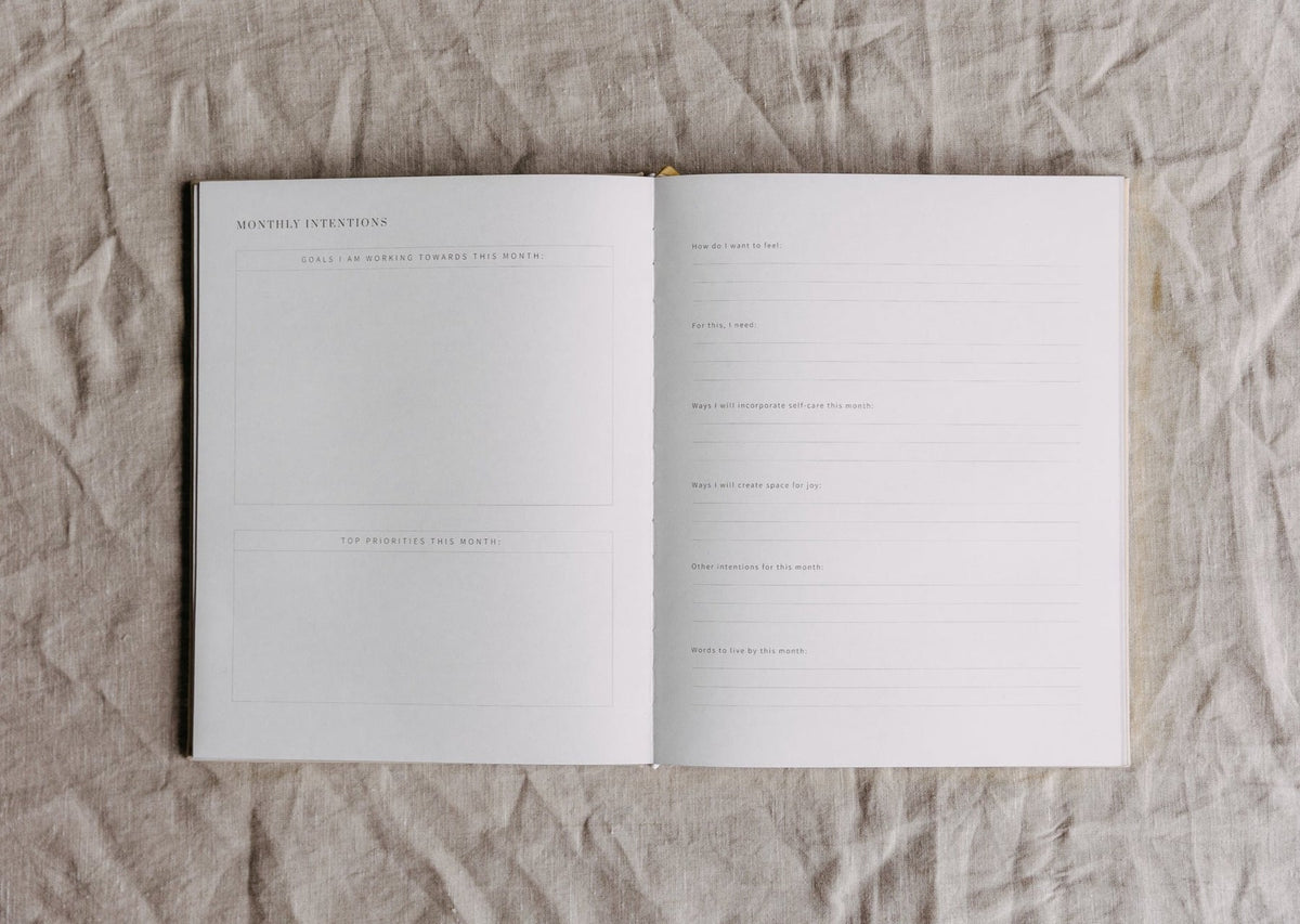 Open spread of the YOU. journal with an instruction page beside a page of lined journalling prompts
