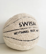 Cream sherpa basketball cushion with Swish Nothing But Net lettering on a plain white surface